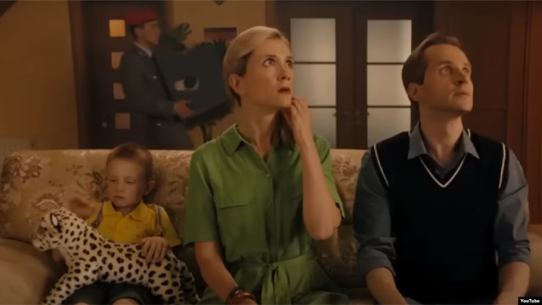 A screen grab taken from a video that was allegedly made in Germany, but which uses Russian actors, including Yulia Konyukhova (center) and Valentin Vorobyov (right). 