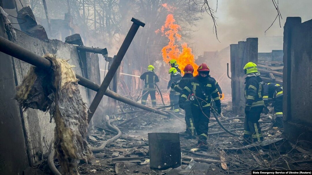 In a handout photo from Ukraine's Emergency Service, firefighters work at the site of a Russian missile strike in Odesa on March 15. 