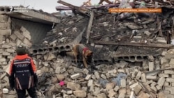 Ukrainian Rescuers Search Debris After Missile Attack 