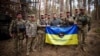Українські військові поблизу Купʼянська з президентом України Володимиром Зеленським, жовтень 2023 року