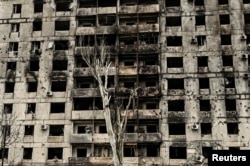A view shows an apartment building heavily damaged by Russian military strikes in the town of Orikhiv, Zaporizhzhia region, on December 13, 2023.