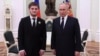 Russian President Vladimir Putin (right) meets with Akhmat Kadyrov in March 2023.