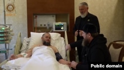 A video posted on September 20 shows Chechen leader Ramzan Kadyrov (front right) visiting his uncle at a Moscow hospital. 