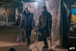 Injured Ukrainian soldiers at a field hospital inside a bunker of the Azovstal steelworks factory in Mariupol, Ukraine, in a handout picture released on May 10, 2022.