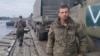 Makar Teplinskiy posted an image of himself posing on a river ferry alongside Russian military equipment on Russian social media on October 10. 