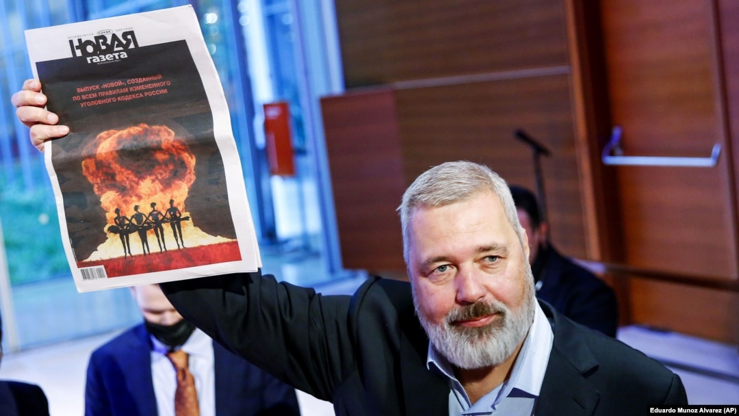 Dmitry Muratov, editor in chief of Novaya gazeta, poses after auctioning off his 2021 Nobel Peace Prize in New York on June 20. He donated the proceeds to raising money for Ukrainian child refugees. 