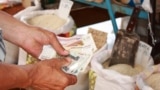 A man pays in Russian rubles at a market in Kazakhstan. With the US dollar tanking in value amid global market turmoil since the Trump administration unveiled a massive tariffs package, the Russian ruble has risen sharply. (file photo)