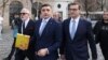 George Simion (center) prepares to file his application for candidacy in Romania's May presidential election in Bucharest on March 14.