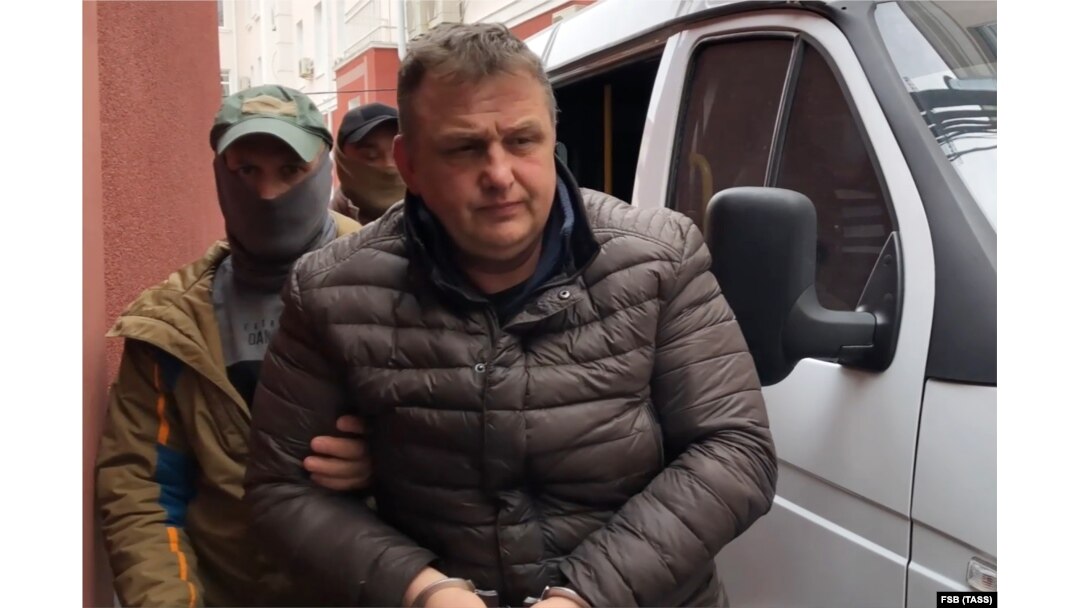 Vladyslav Yesypenko is detained by FSB officers in Crimea on March 16.