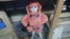 A dummy of a child dressed in an anti-radiation suit inside a nuclear shelter in Prague