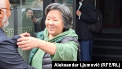 Dinara Smailova greets her husband, Almat Mukhamedzhanov, after her release at Montenegro's Higher Court in Podgorica on April 15.