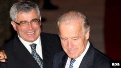 U.S. Vice President Joe Biden (right) is welcomed to Sarajevo by Bosnian Foreign Minister Sven Alkalaj.
