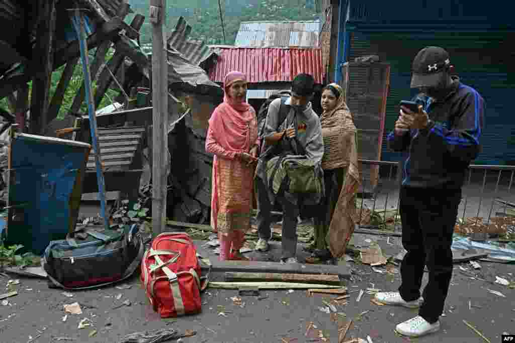 Local residents prepare to evacuate after Pakistani artillery shelling in Lagama village in Uri, about 100 kilometers from Srinagar, in Indian-administered Jammu and Kashmir in the disputed Kashmir region, on May 9.