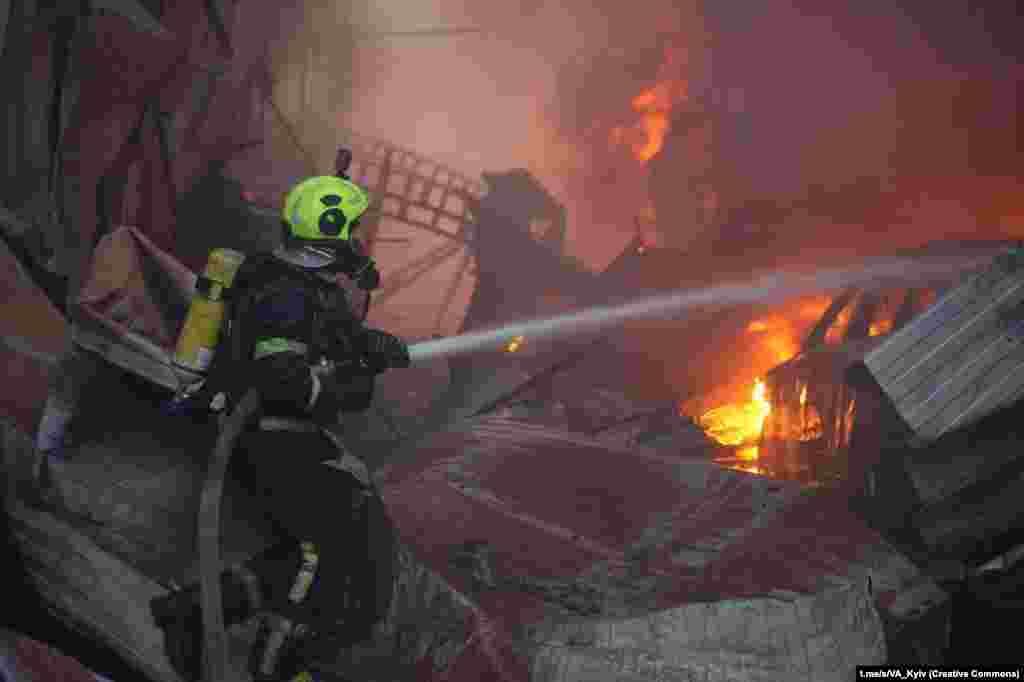 Firefighters work after a Russian attack on Kyiv on April 6.