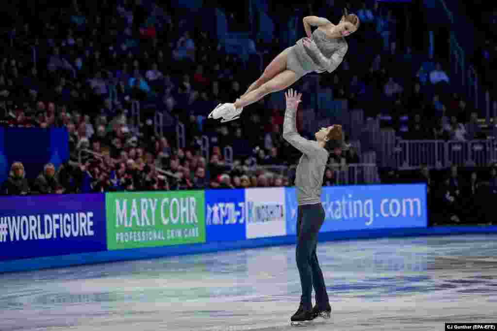Katerina Geynish and Dmitrii Chigirev of Uzbekistan perform during the Pairs Short Program at the world figure-skating championships in the U.S. city of Boston.