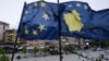 The EU and Kosovar flags in the main square of Pristina