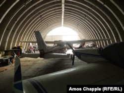 Light aircraft inside a Soviet-made warplane hangar in March 2025.