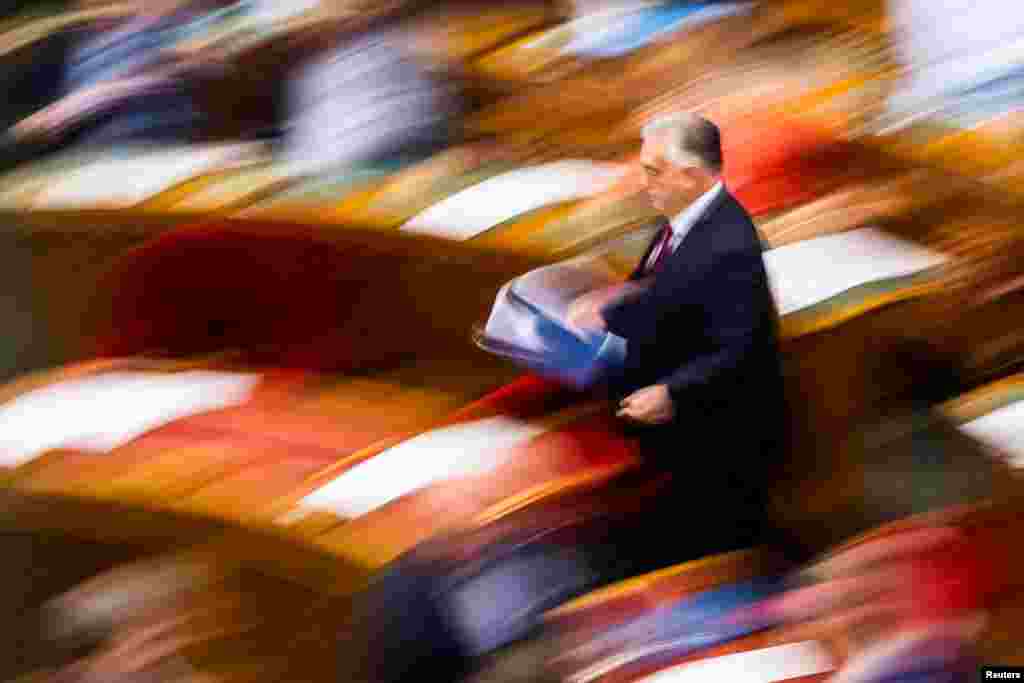 Hungarian Prime Minister Viktor Orban arrives for a vote in the parliament in Budapest on withdrawing Hungary from the International Criminal Court.