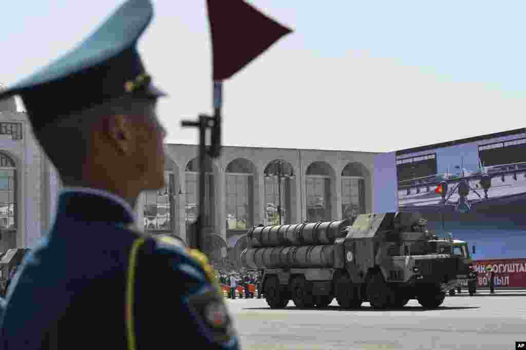 A Kyrgyz soldier looks on during a military parade in Bishkek to commemorate Victory Day in World War II.