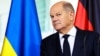 GERMANY – GermanGerman Chancellor Olaf Scholz looks on, as he and Ukrainian President Volodymyr Zelenskyy give statement before talks in Berlin, Germany, October 11, 2024