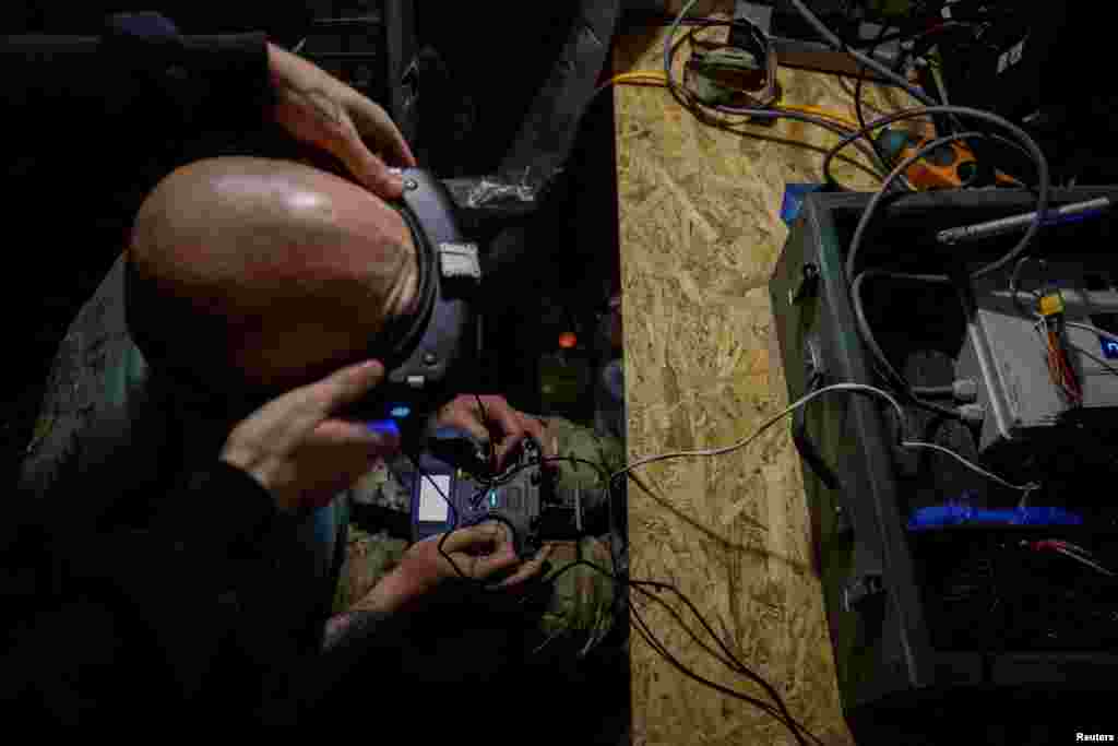 A Ukrainian soldier operates a first-person view (FPV) near Russian positions not far from the front line in the Dnipropetrovsk region.