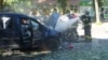 A fireman douses a car after a Russian attack on Ukraine's Sumy on June 3.