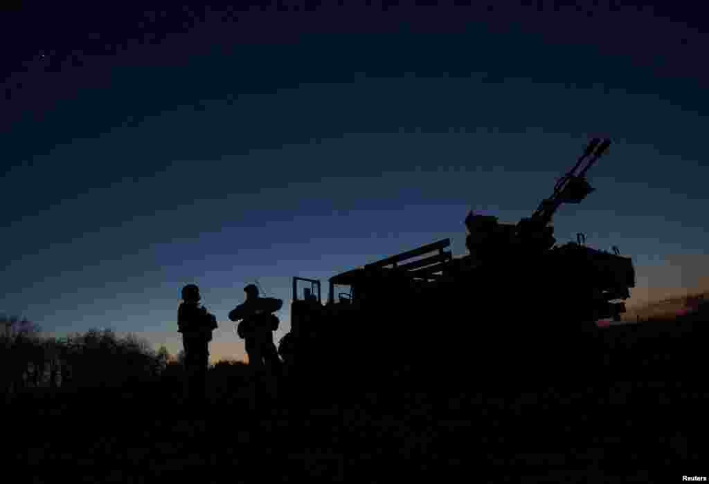 Ukrainian soldiers from an anti-drone mobile air defense unit of are seen at their position in the Donetsk region.