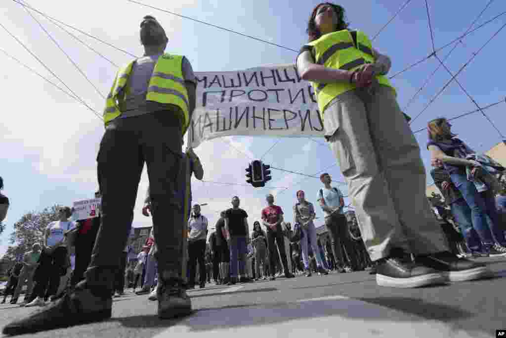 Serbian students stand in silence in Belgrade to commemorate the 16 victims killed after a railway concrete canopy fell in November and to demand an immediate snap election after leading months of anti-corruption demonstrations, in Belgrade