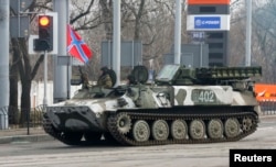 Pro-Russian rebels drive a self-propelled antiaircraft system in Donetsk on February 3.
