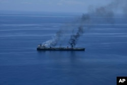 Fires burn aboard the oil tanker Sounion in the Red Sea after it was struck by the Houthis on August 25.