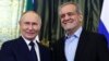 Russian President Vladimir Putin (left) and his Iranian counterpart, Masud Pezeshkian, meet in Moscow on January 17.