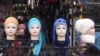 Mannequins in a shop show the head-scarf style officially promoted for women in Uzbekistan.