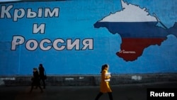 A mural in Moscow with a map of the Ukrainian peninsula of Crimea in Russia's national colors and the words "Crimea and Russia." 