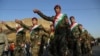 Kurdish Peshmerga fighters march to promote the independence referendum in Irbil on September 13.