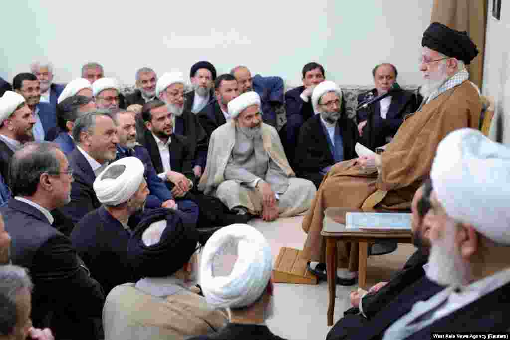 Iranian Supreme Leader Ayatollah Ali Khamenei (right) speaks during a meeting with government officials in Tehran.