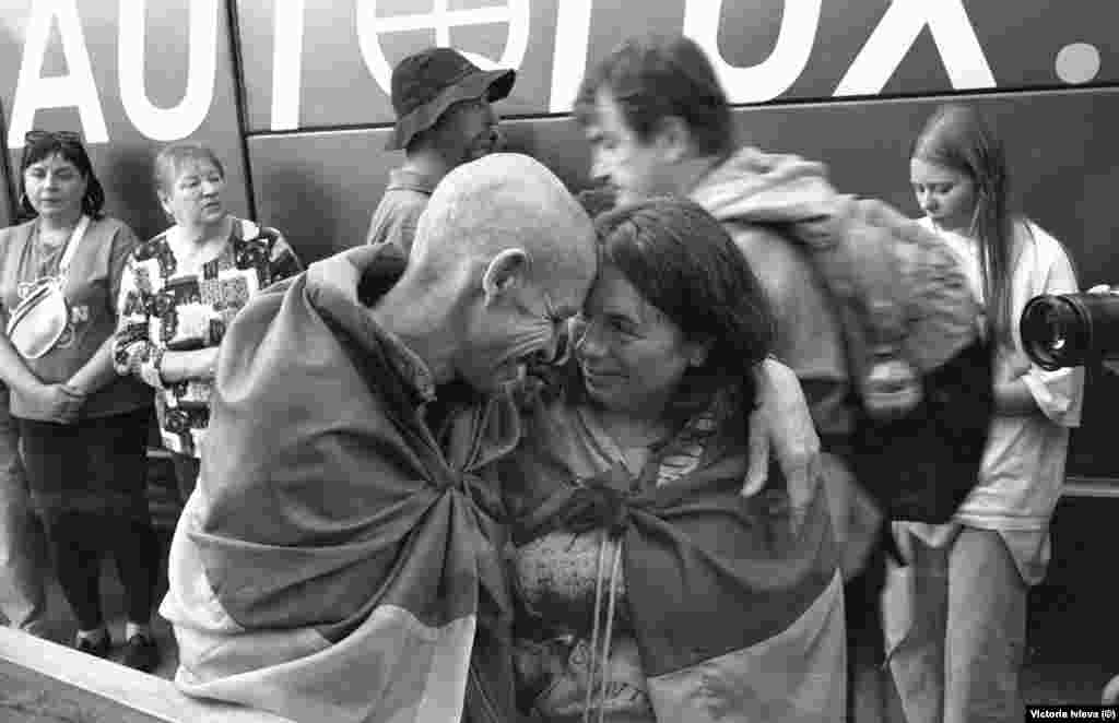A Ukrainian soldier released in a prisoner exchange with Russia embraces a loved one in Chernihiv.
