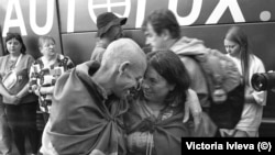 A Ukrainian soldier released in a prisoner exchange with Russia embraces a loved one in Chernihiv.