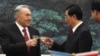 Kazakhstan's President Nursultan Nazarbayev (left) toasts with his Chinese counterpart, Hu Jintao, during a signing ceremony at the Great Hall of the People in Beijing on February 22.