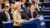 European Commission President Ursula von der Leyen speaks at the European Parliament on October 9 as Hungarian Prime Minister Viktor Orban (right) looks on.