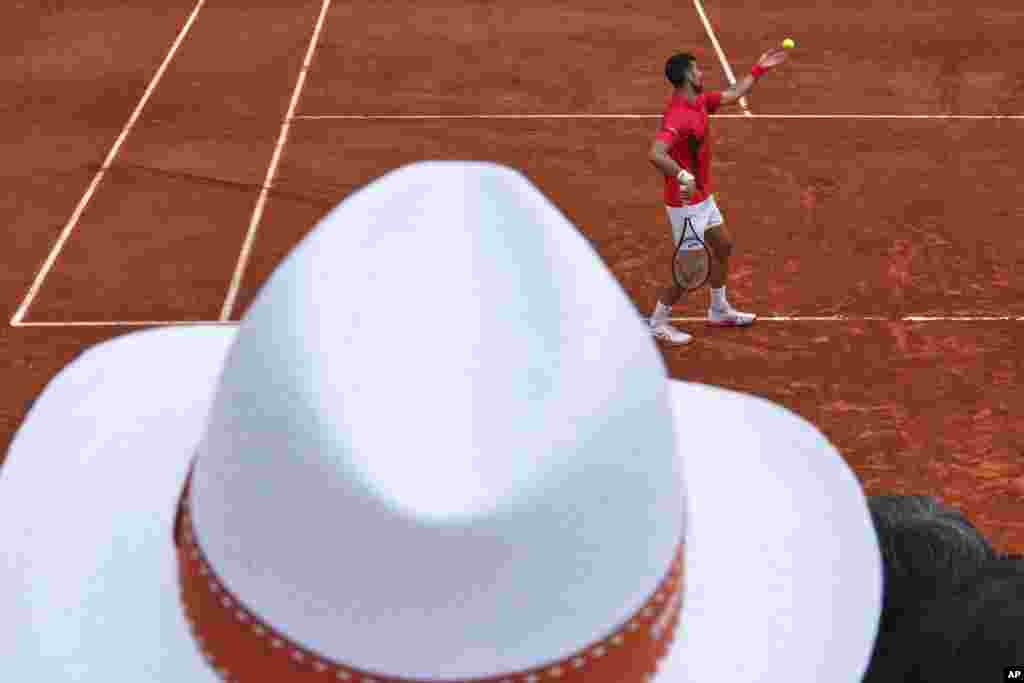 Serbian tennis player Novak Djokovic serves against France's Corentin Moutet during their second round match at the French Open.