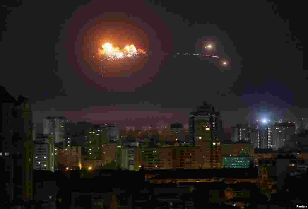 A ballistic missile explodes in the sky over the city during a Russian drone strike on Kyiv on April 24.